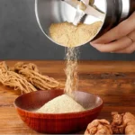 Multifunctional 4-Blade Electric Grain Grinder with its packaging