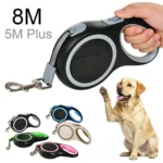 Green retractable dog leash with nylon webbing and quick-release mechanism